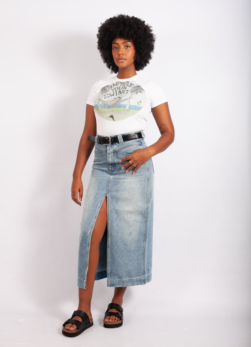 girl wearing a blue long denim skirt with a belt on the waste